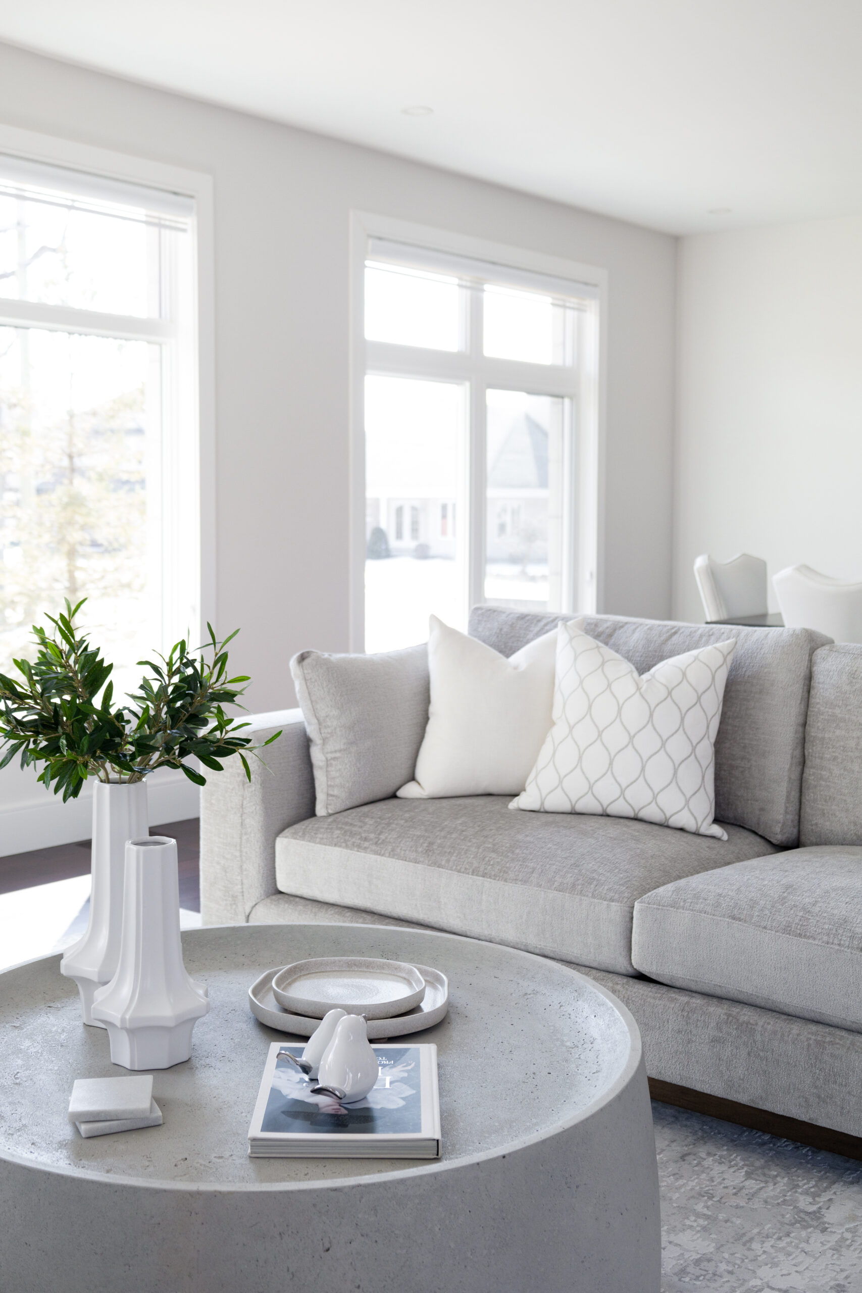 Living room furniture, with grey couch and grey coffee table, at Polanco furniture store in Westboro
