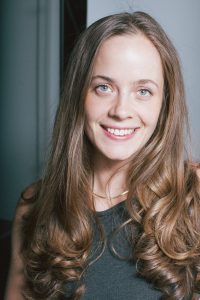 An image of a woman with light brown hair. 