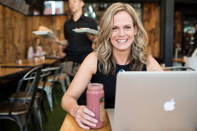 Woman in coffee shop with laptop