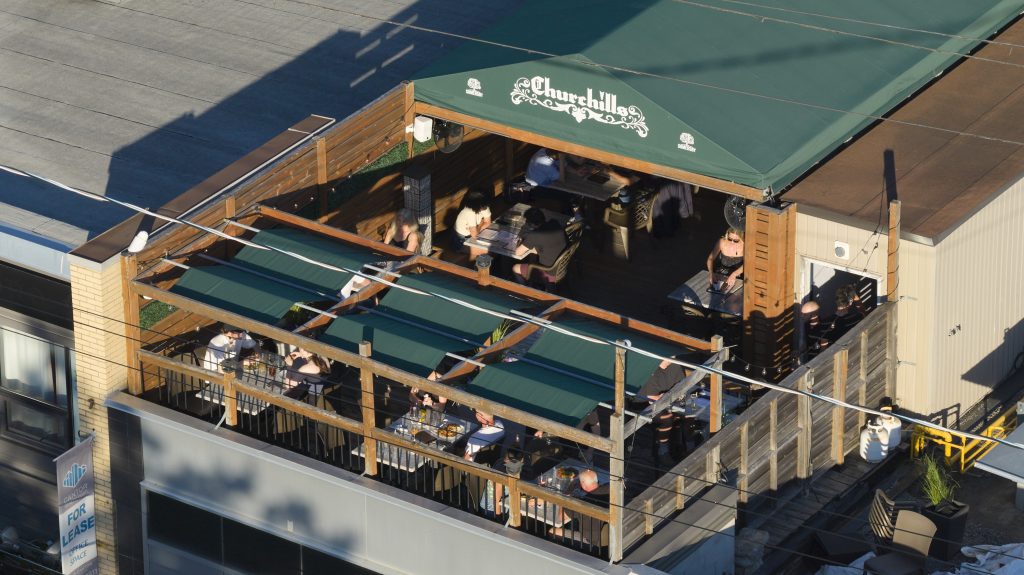 Rooftop patio dining area at Churchills Pub in Westboro Village, Ottawa